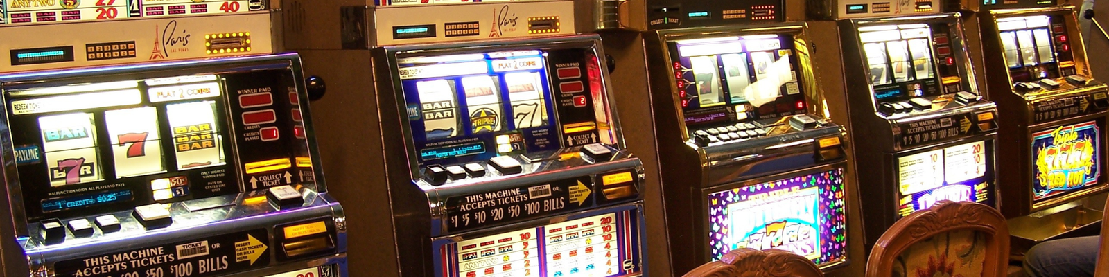 A picture of a casino with slot machines 5